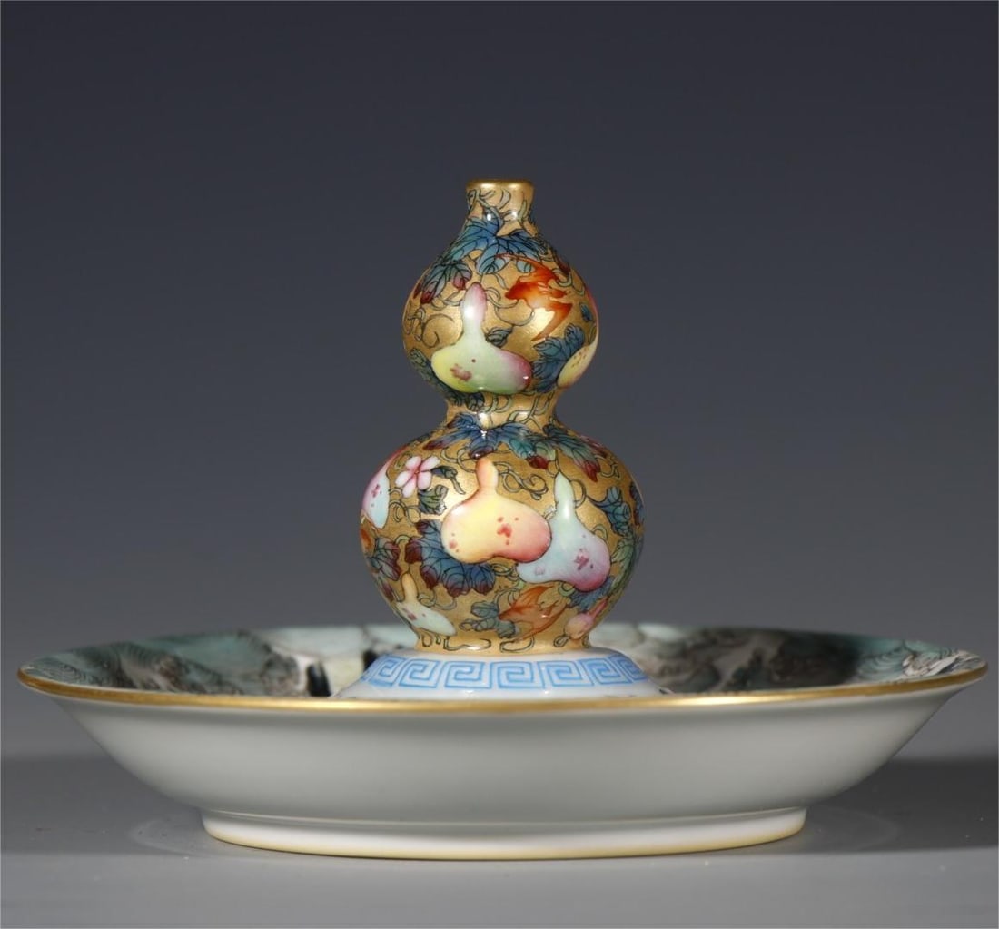 An enamel gourd made in the Yongzheng era of the Qing Dynasty with a golden ground incense insert (1 of 8)