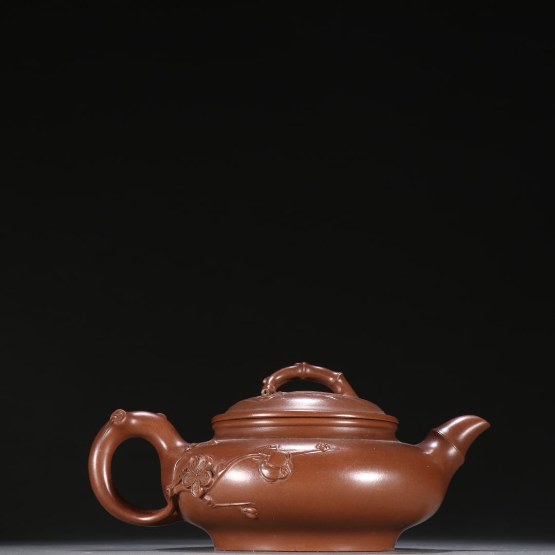 A purple sand plum pattern teapot of Wang Yinxian (1 of 9)