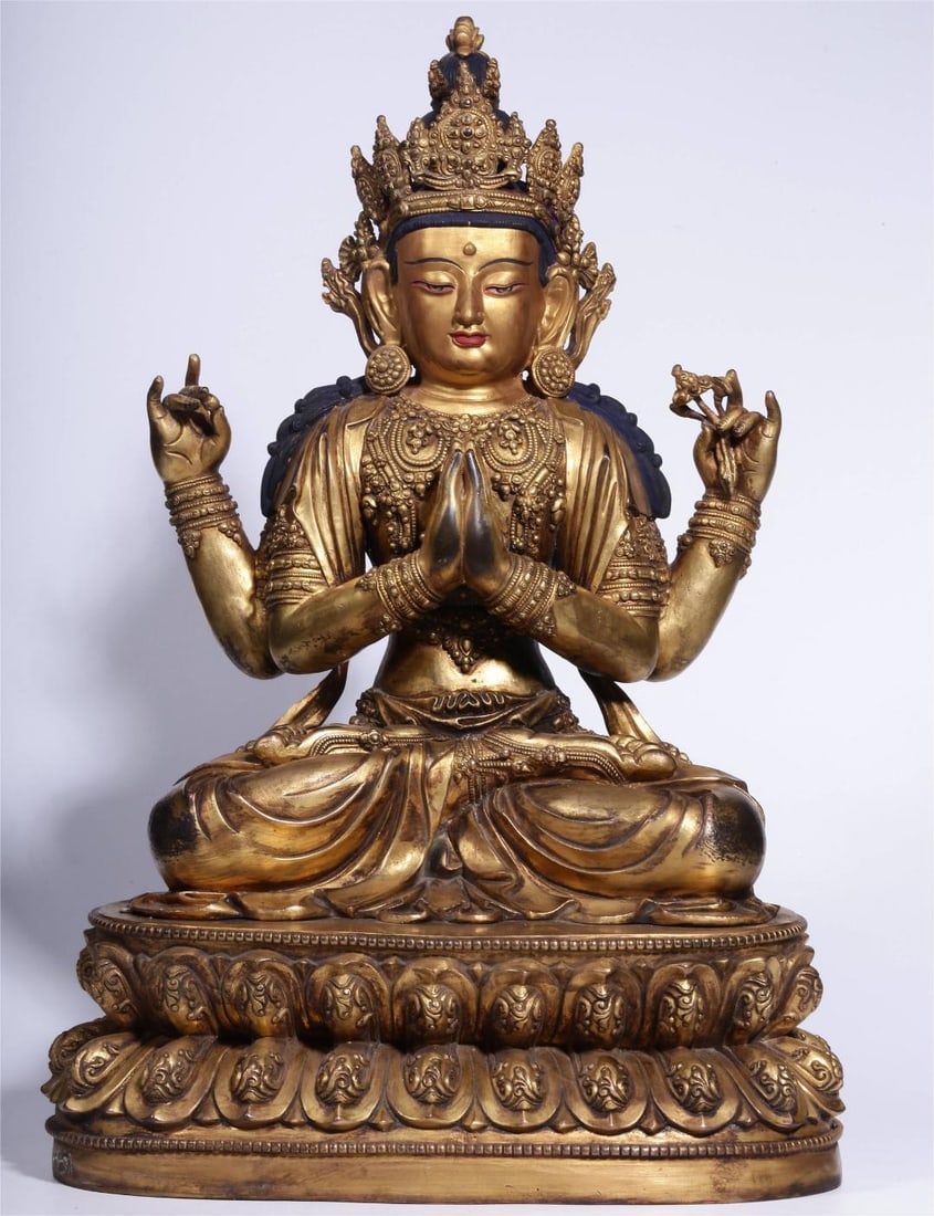 A bronze gilt four-armed seated statue of Guanyin from the Qing Dynasty (1 of 11)