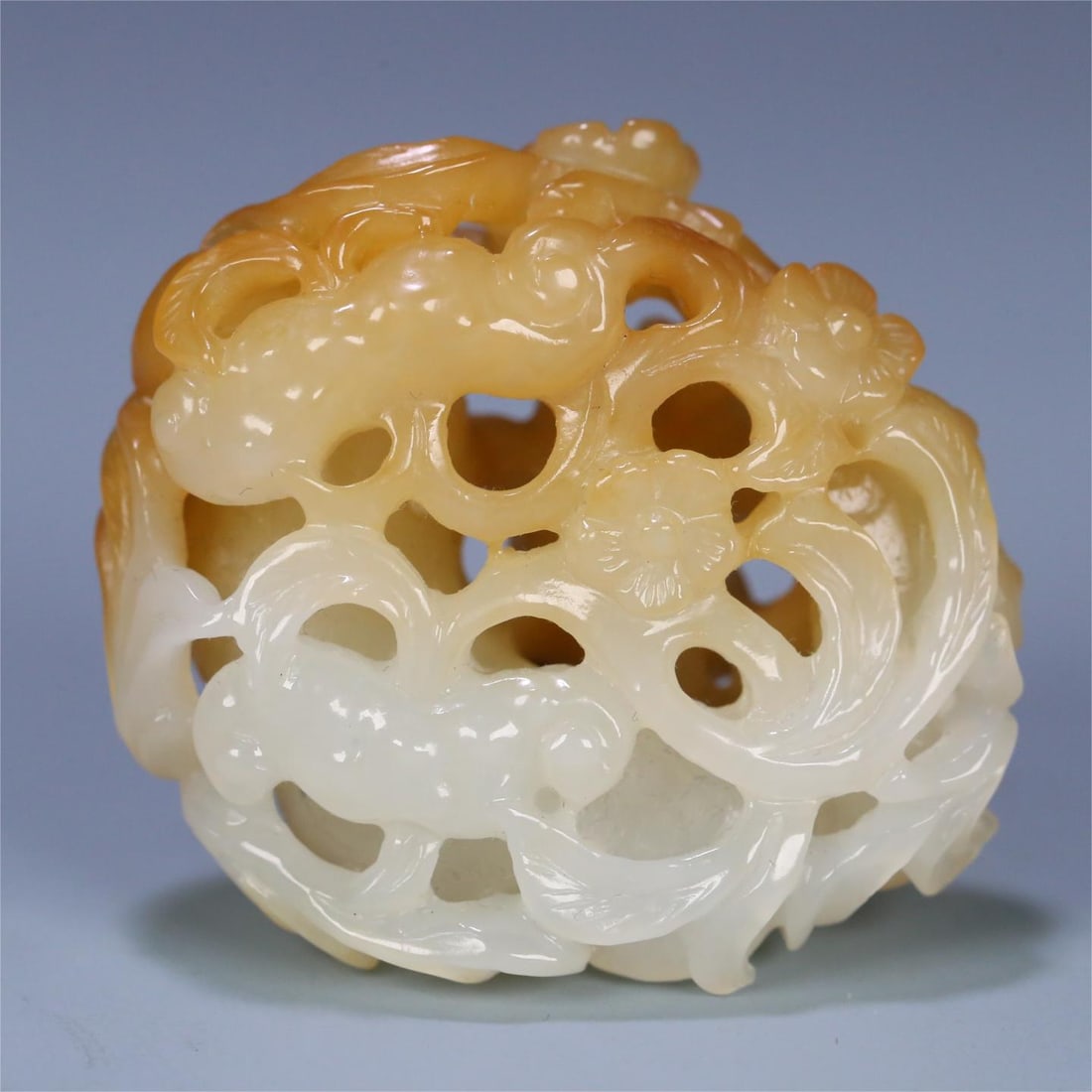 A Qing Dynasty Hetian jade hollow carved Ganoderma lucidum plum blossom handle (1 of 9)