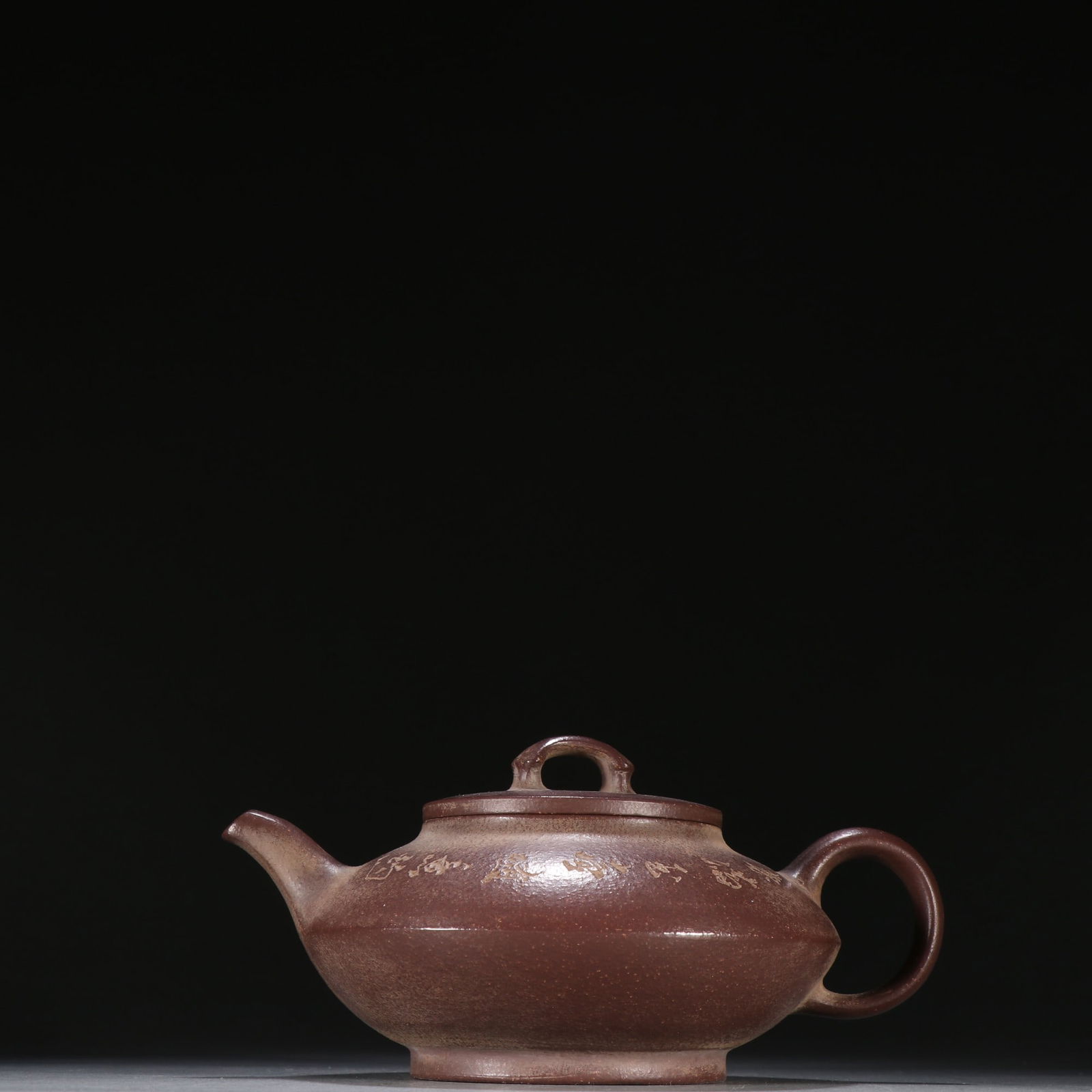 A purple sand carved poetry teapot of Zhou Faxiang: Zhou Faxiang's purple sand carved poetry teapot Size:H:9cmW:17cm (The Dimensions Of All Batches Are Manually Measured.If You Need More Detailed Information, Please Contact Our Customer Service Before