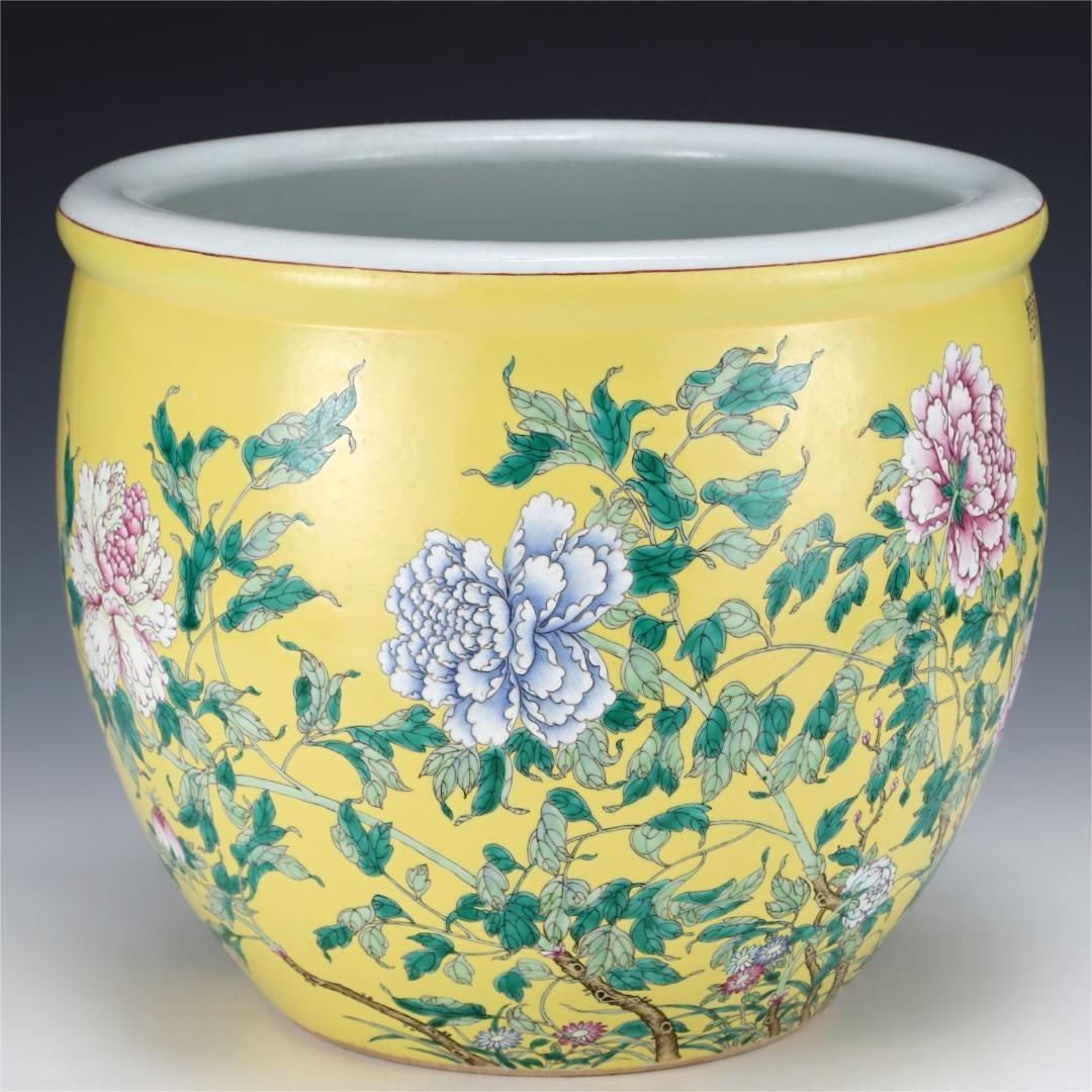 A Qing Dynasty body and palace yellow glaze pastel flower roll jar (1 of 9)