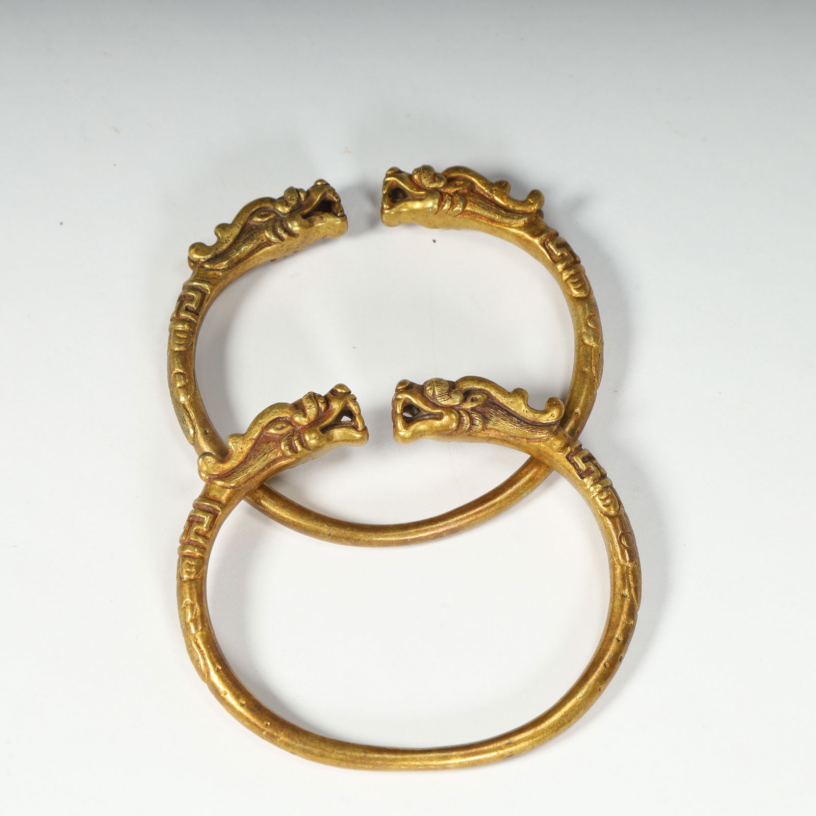 A Qing Dynasty copper gilt dragon head pattern bracelet (1 of 7)