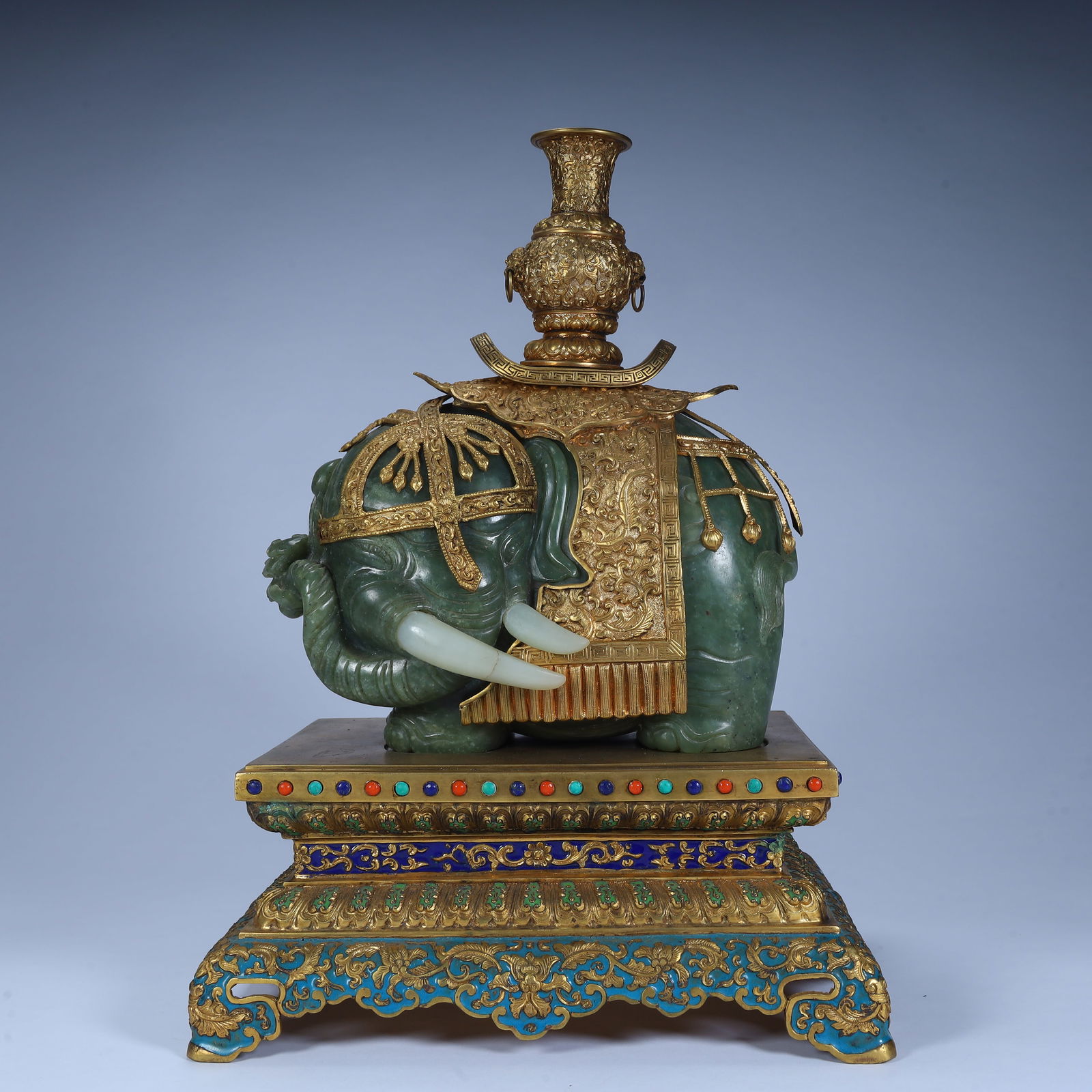 A Qing Dynasty jasper inlaid with gold "Taiping Youxiang" ornament: Qing Dynasty jasper inlaid gold "Taiping Elephant" ornament SIZE: Total H: 23cm L: 24cm W: 16.5cm W: 7.2kg (The Dimensions Of All Batches Are Manually Measured.If You Need More Detailed