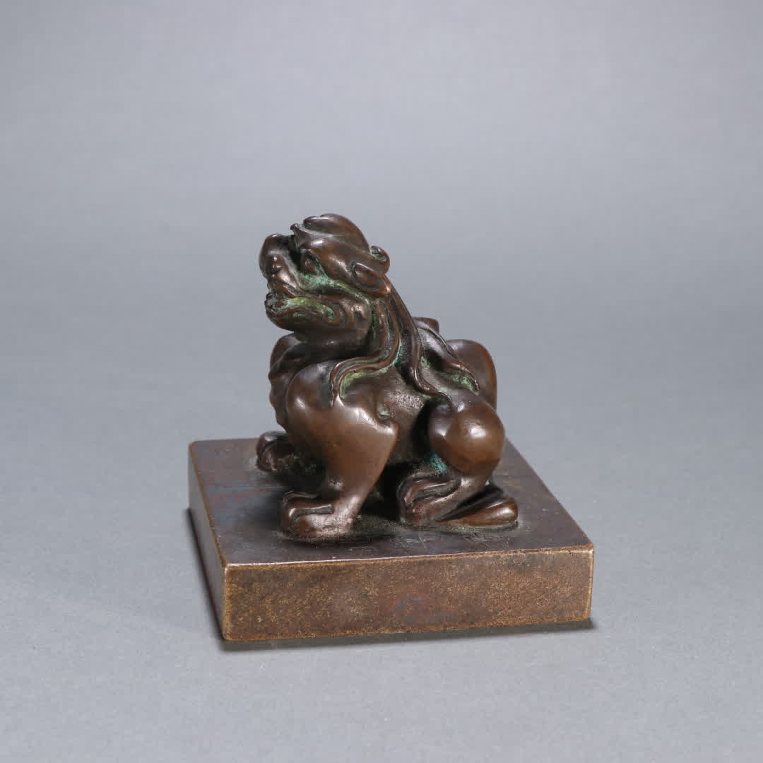 A Qing Dynasty bronze auspicious beast button seal (1 of 9)