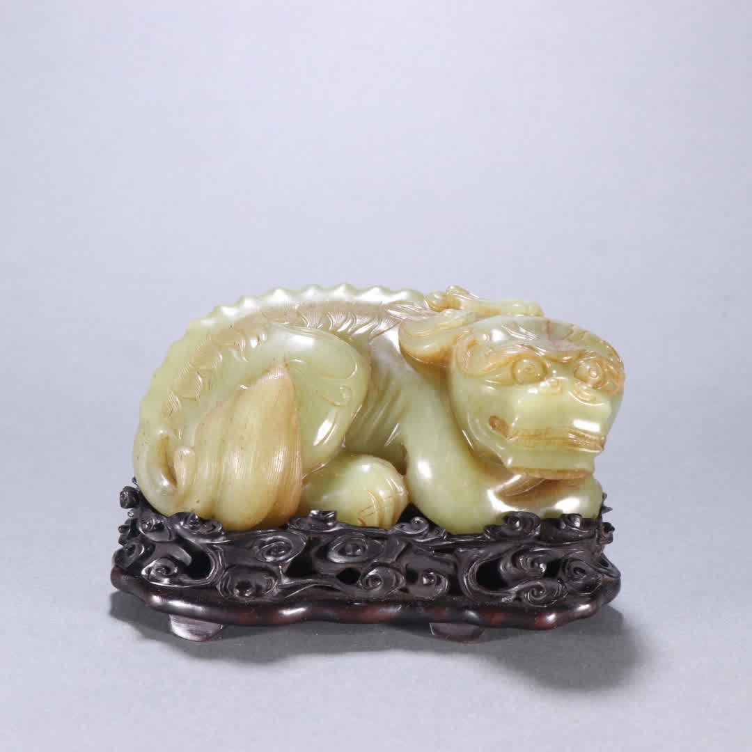 A Qing Dynasty Hetian topaz beast ornament (1 of 9)