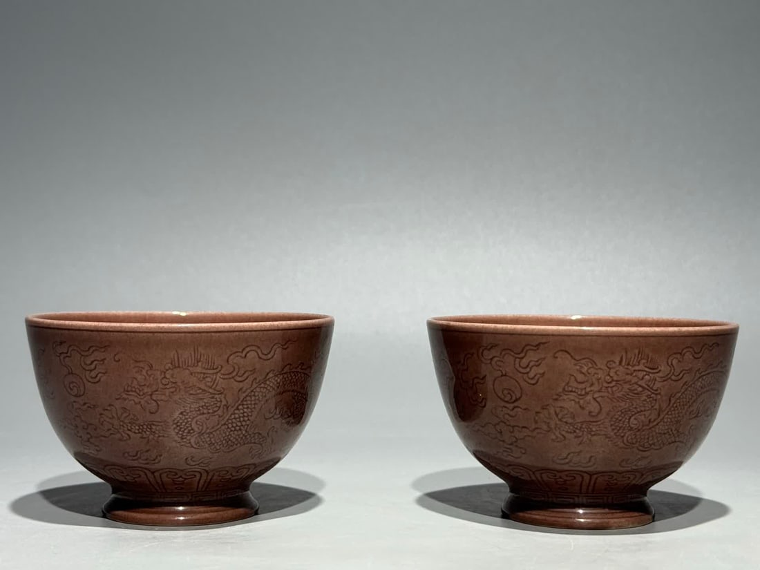 A pair of Daoguang year system eggplant skin purple secretly engraved double dragon play bead: Daoguang year system eggplant skin purple secretly engraved double dragon play bead hand cup SIZE: H:5cm mouthD:8.2cm (The Dimensions Of All Batches Are Manually Measured.If You Need More