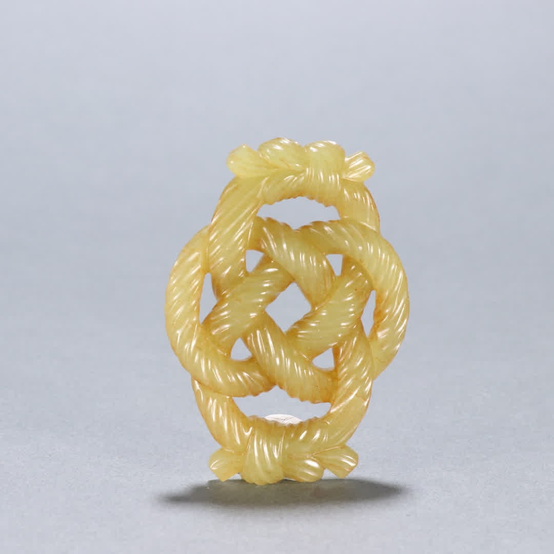 A Qing Dynasty Hetian topaz twisted silk ring pendant: Qing Dynasty Hetian topaz twisted silk ring ornament SIZE: H:7cm W:5cm W:45.3g (The Dimensions Of All Batches Are Manually Measured.If You Need More Detailed Information, Please Contact Our Customer S
