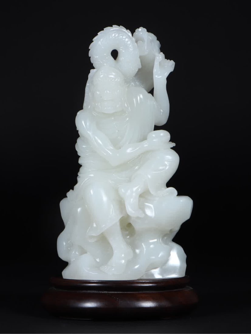 A Qing Dynasty Hetian white jade dragon descending Arhat ornament: Qing Dynasty Hetian white jade dragon descending Arhat ornament SIZE: L:9.2cm W:5.3cm H:17.5cm W:927g (The Dimensions Of All Batches Are Manually Measured.If You Need More Detailed Information,