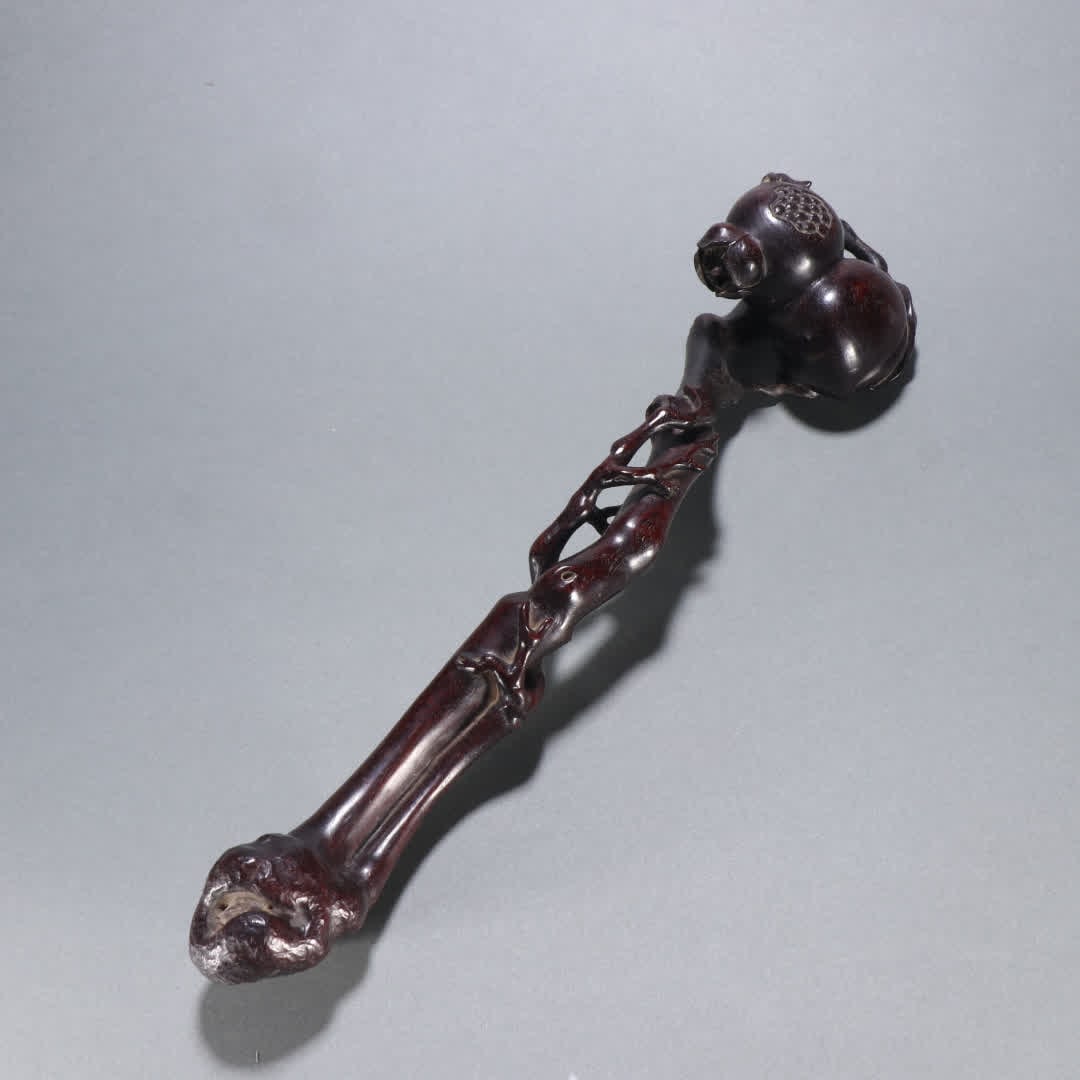 A Qing Dynasty rosewood longevity peach ruyi handle (1 of 9)