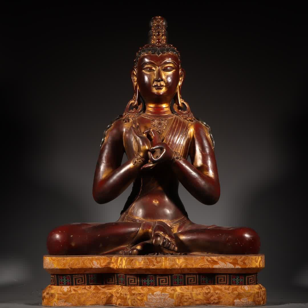 A Tibetan statue of Tara Bodhisattva in copper clay and gold: Tibetan statue of Tara Bodhisattva in copper clay and gold SIZE: W:… About 16kg Net H: 55cm with base 65cm W: 43cm T: 25cm (The Dimensions Of All Batches Are Manually Measured.If You Need More