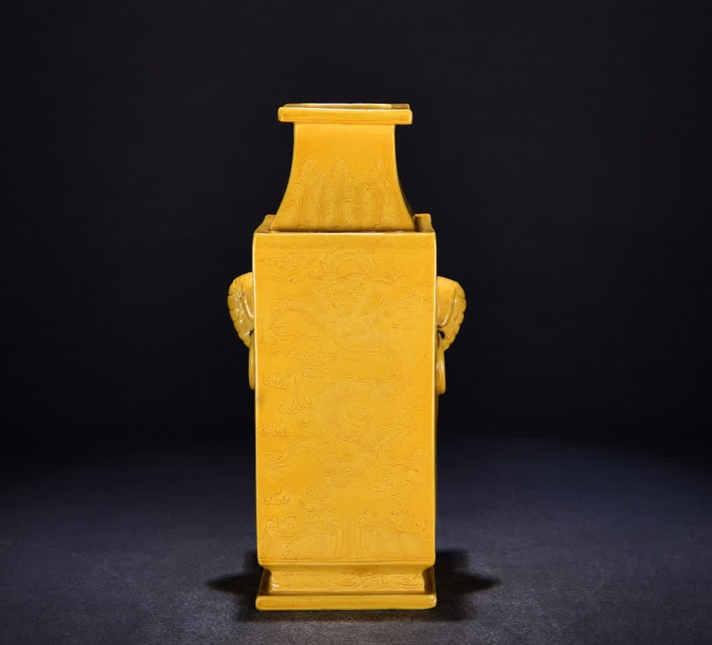 A Qing Qianlong delicate yellow glaze dark engraved dragon pattern square bottle: Qing Qianlong delicate yellow glaze secretly engraved dragon pattern square bottle SIZE: H:30cm W:14cm (The Dimensions Of All Batches Are Manually Measured.If You Need More Detailed Information, Pleas