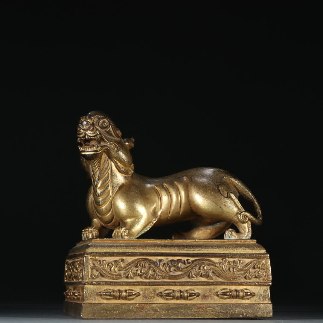 A Qing Dynasty copper gilt auspicious beast button seal (1 of 9)