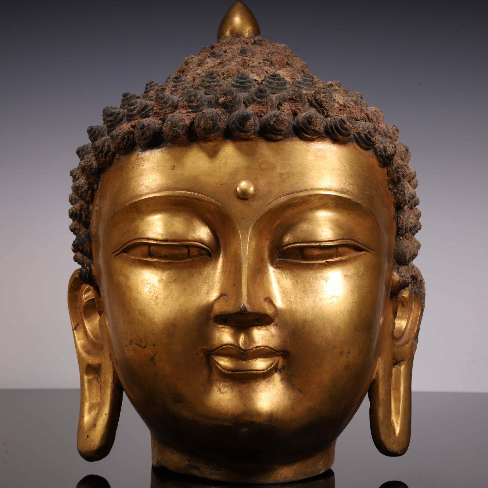 A clear gilt Buddha head (1 of 12)