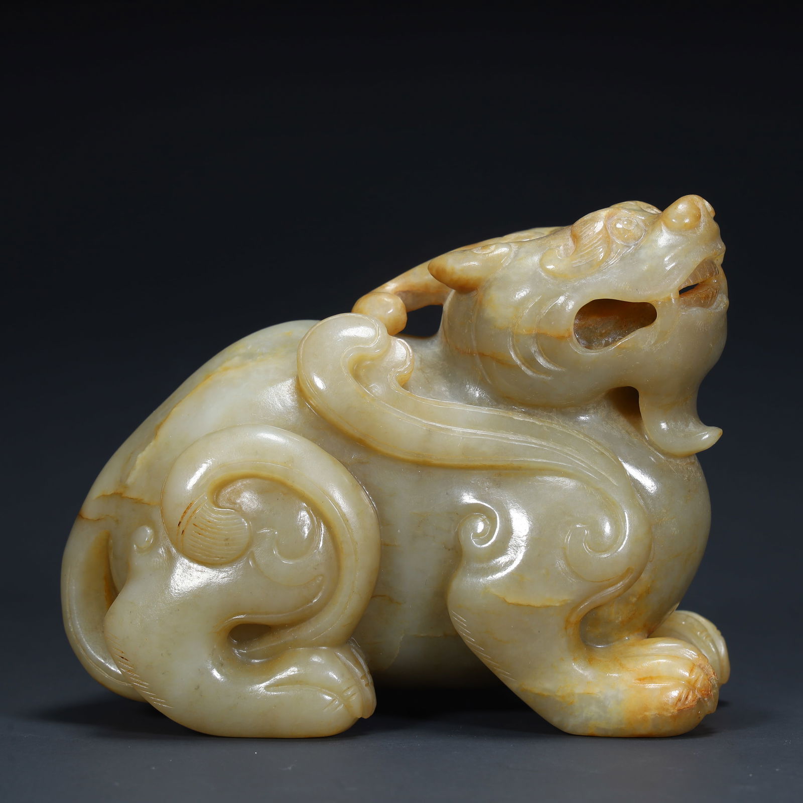 A Qing Dynasty Hetian jade beast ornament (1 of 12)