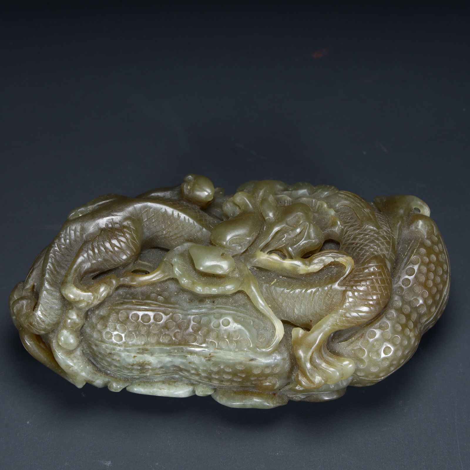 A Qing Dynasty Hetian jade beast ornament (1 of 9)