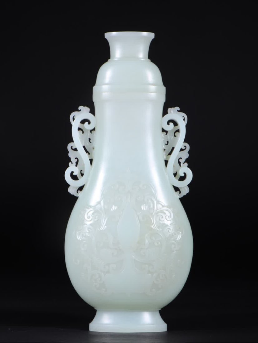 A Qing Dynasty Hetian jade entwined lotus pattern double phoenix ear bottle: Qing Dynasty Hetian jade entwined lotus pattern double phoenix ear bottle SIZE: L:9.2cm W:4.9cm H:21.5cm W:409g (The Dimensions Of All Batches Are Manually Measured.If You Need More Detailed Informati