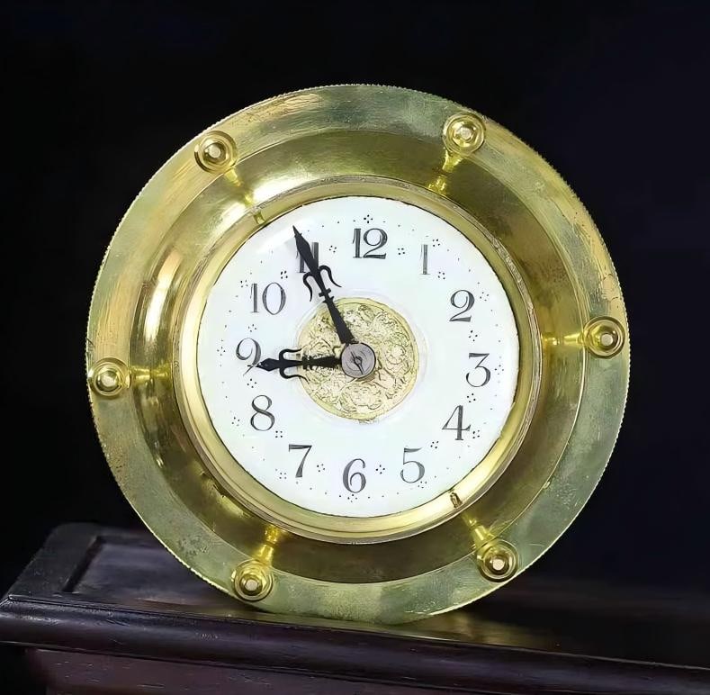 A 24-hour clock in copper gilt (1 of 9)
