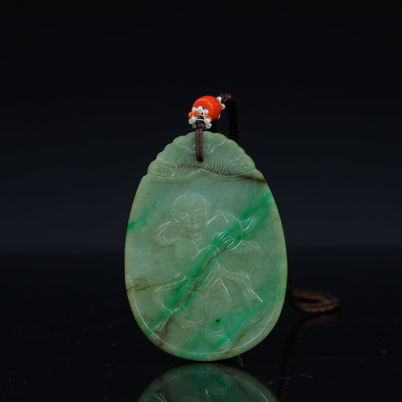 A Qing Dynasty jade boy holding a peach pattern card (1 of 10)