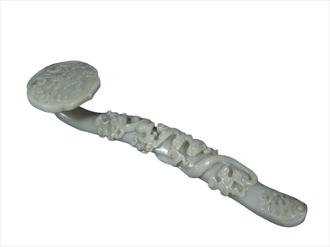 A Qing Dynasty Hetian jade relief dragon pattern ruyi ornament: Qing Dynasty Hetian jade relief dragon pattern ruyi ornament SIZE: L:31cm W:8.1cm H:5.2cm W:548g (The Dimensions Of All Batches Are Manually Measured.If You Need More Detailed Information, Please Cont