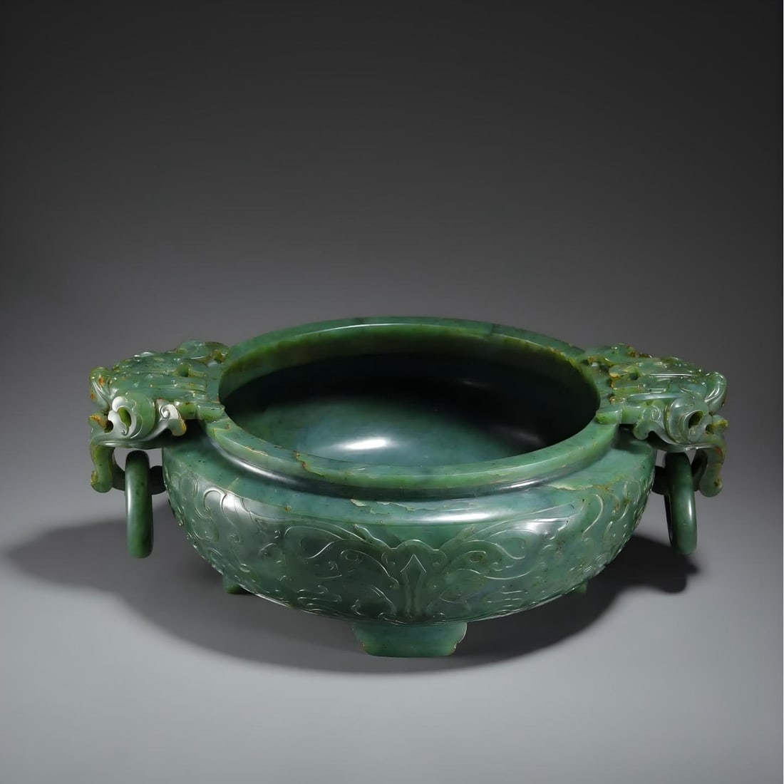 A living ring furnace with a Qing Dynasty Hetian jasper beast face pattern: Qing Dynasty Hetian jasper beast face pattern living ring furnace SIZE: 28x22x10cm W:2380g (The Dimensions Of All Batches Are Manually Measured.If You Need More Detailed Information, Please Contact Ou
