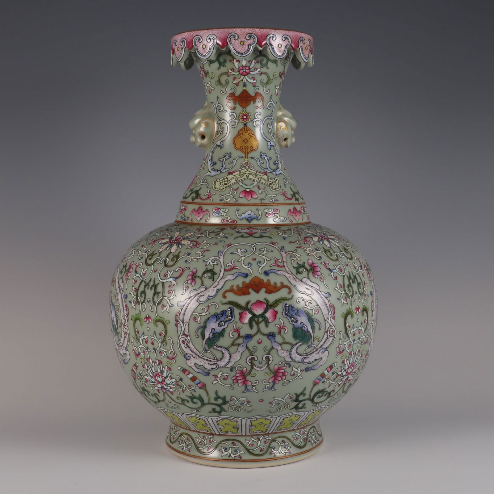 An Exquisite Famille-Rose Celadon Glazed Bats and Peach Pattern Lotus Pattern Double-Ears Vase: An Exquisite Famille-Rose Celadon Glazed Bats and Peach Pattern Lotus Pattern Double-Ears Vase Qing Dynasty, China Qianlong Six-character Mark Size:45.5cmx29cm (The Dimensions Of All Batches Are Manua