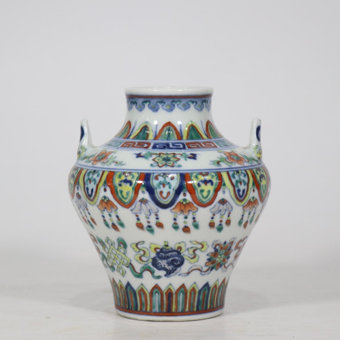 An Exquisite Doucai Eight Treasures Pattern Double-Ears Vase: An Exquisite Doucai Eight Treasures Pattern Double-Ears Vase Qing Dynasty, China Qianlong Six-character Mark Size:12cmx10.5cm (The Dimensions Of All Batches Are Manually Measured.If You Need More Deta