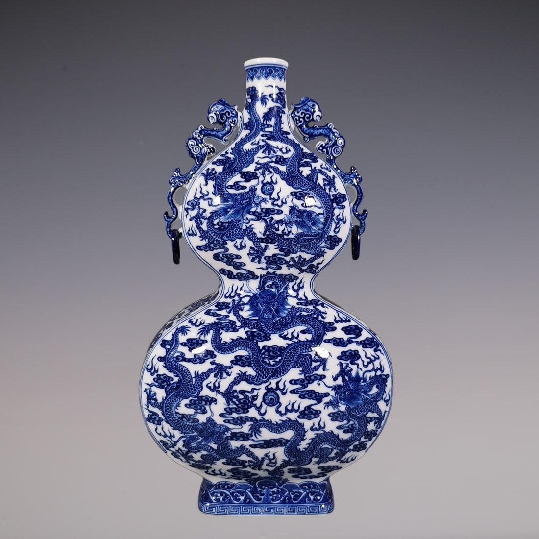 An Exquisite Blue and White Eight Treasures Pattern Dragon Pattern Seawater Pattern Gourd-Shaped: An Exquisite Blue and White Eight Treasures Pattern Dragon Pattern Seawater Pattern Gourd-Shaped Double-Ears Vase Qing Dynasty, China Qianlong Six-character Mark Size:42.7cmx24.5cm (The Dimensions Of