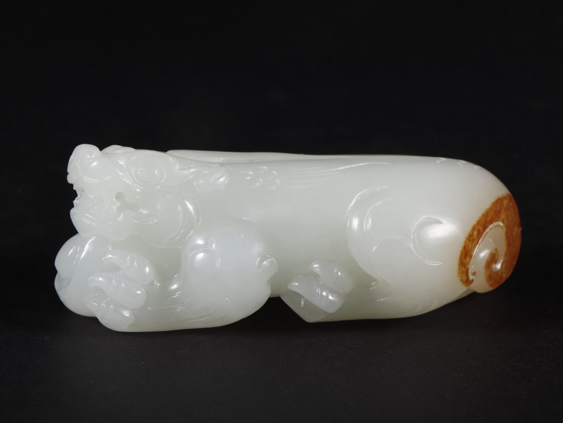 An Exquisite White Jade Auspicious Beast Hand Piece (1 of 9)