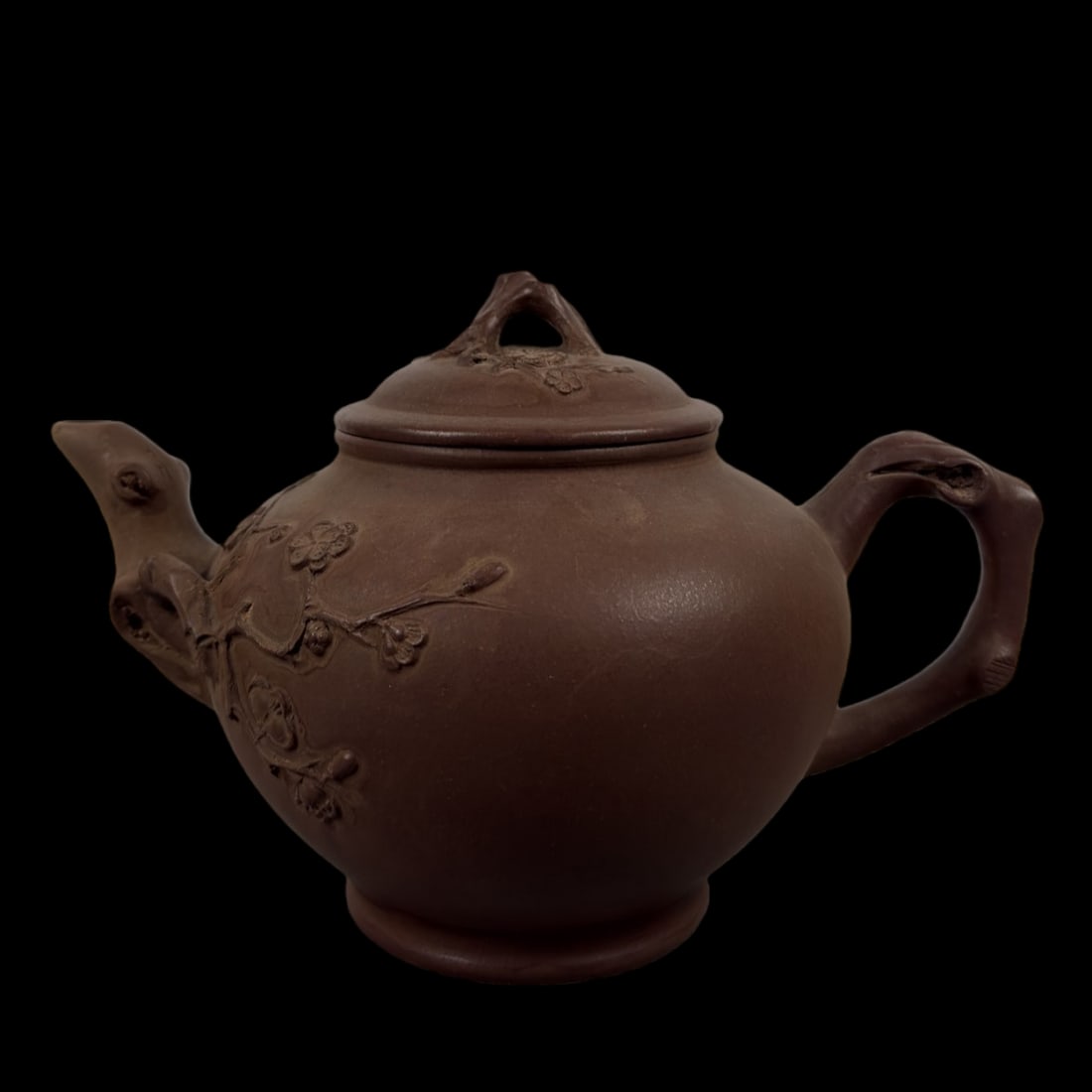 An Exquisite Purple Sands Plum flower Pattern Teapot: An Exquisite Purple Sands Plum flower Pattern Teapot Zhu ke xin Size:18.2cmx12cm (The Dimensions Of All Batches Are Manually Measured.If You Need More Detailed Information, Please Contact Our Customer