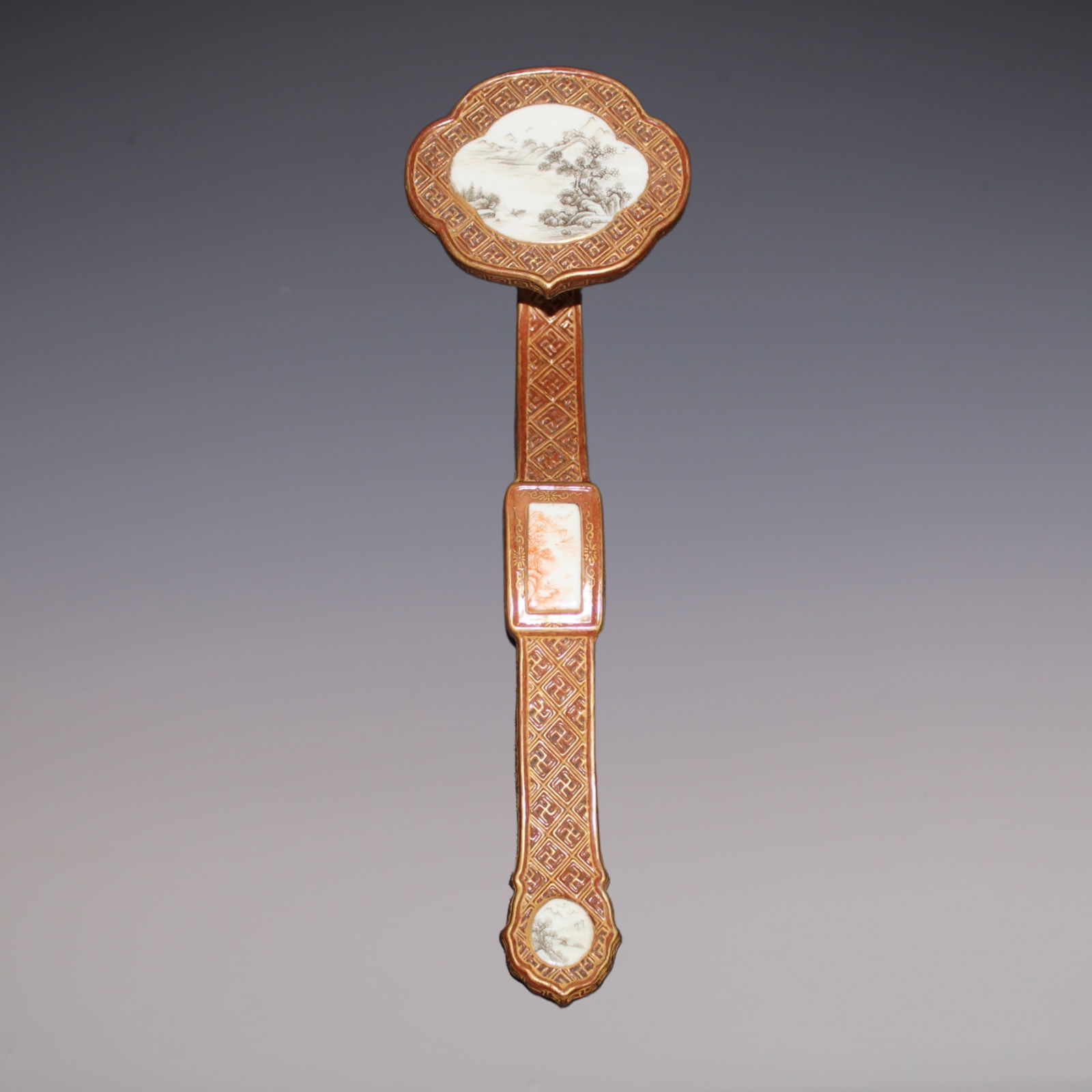 An Exquisite Ink Color Iron-Red Landscape Pattern Ruyi: An Exquisite Ink Color Iron-Red Landscape Pattern Ruyi Qing Dynasty, China Qianlong Six-character Mark Size:21.5cm (The Dimensions Of All Batches Are Manually Measured.If You Need More Detailed