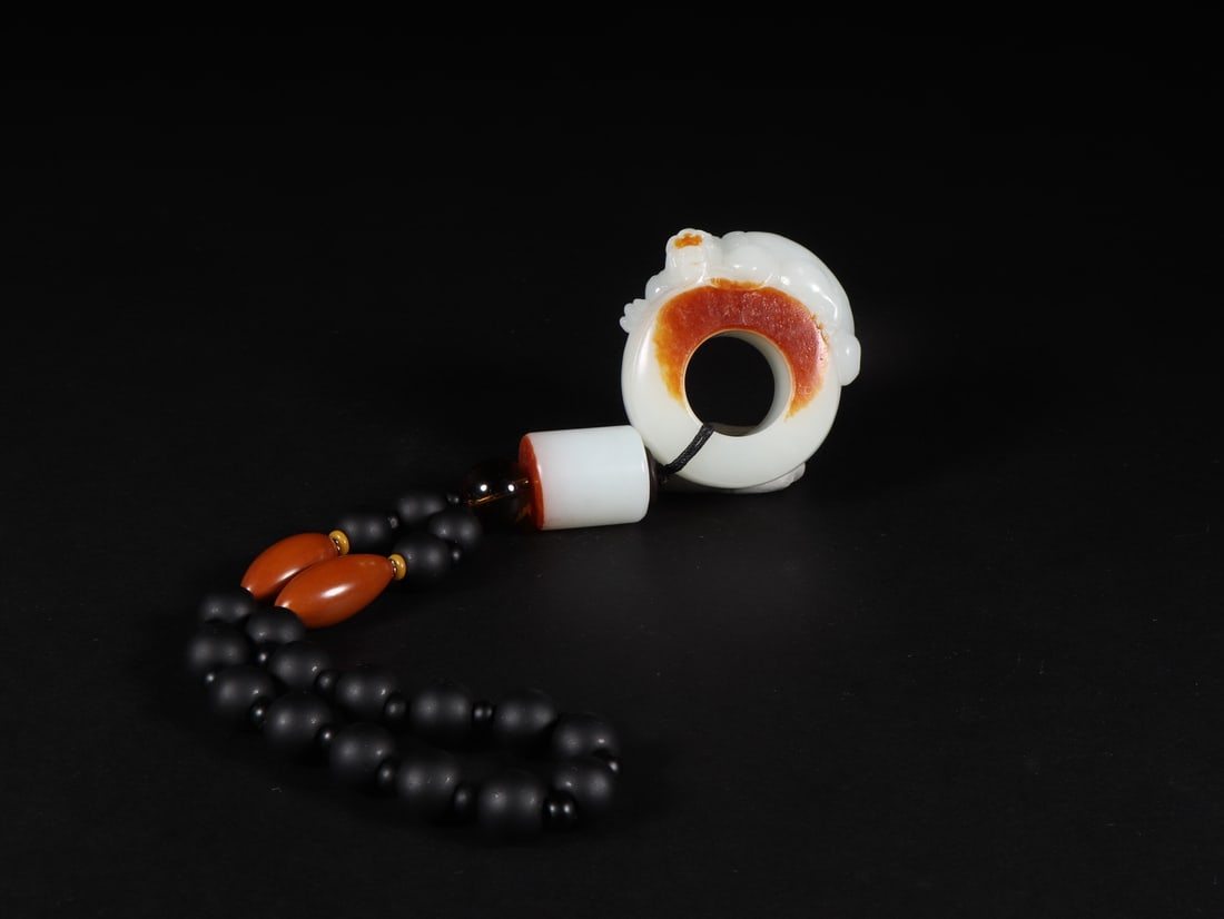 An Exquisite White Jade Ring: An Exquisite White Jade Ring Qing Dynasty, China Size:(inside diameter)2.2cm Size:5.1cmx5.6cmx2.2cm Weight:163g (The Dimensions Of All Batches Are Manually Measured.If You Need More Detailed