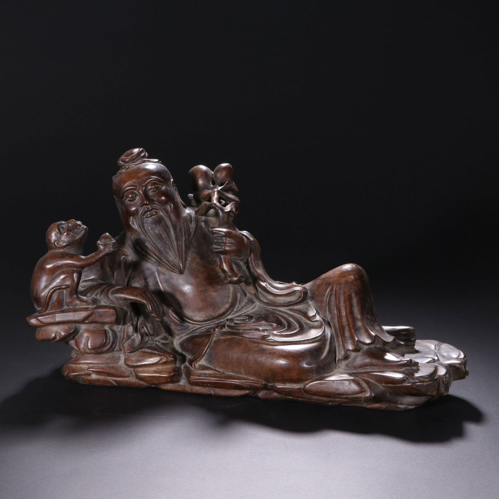 An Exquisite Huanghuali wood Figure Ornament: An Exquisite Huanghuali wood Figure Ornament Qing Dynasty, China Size:31cmx16.5cm (The Dimensions Of All Batches Are Manually Measured.If You Need More Detailed Information, Please Contact Our