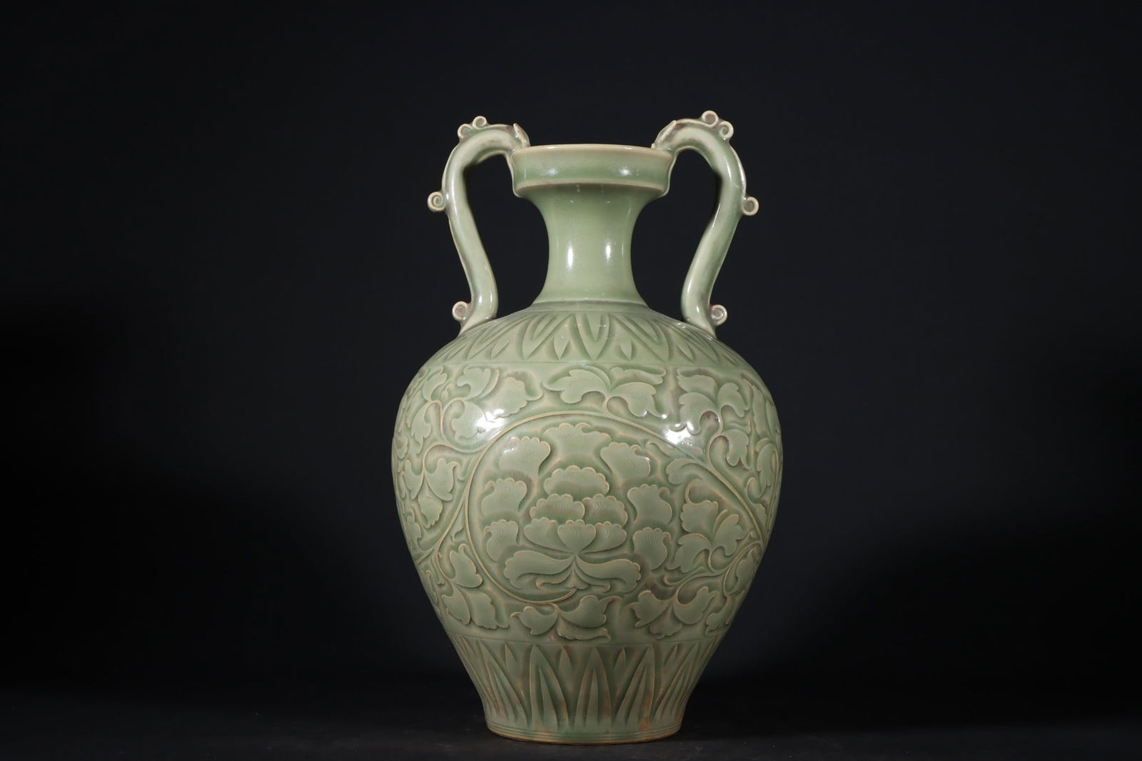 An Exquisite Yaozhou yao Celadon Glazed Lotus Pattern Double-Ears Vase: An Exquisite Yaozhou yao Celadon Glazed Lotus Pattern Double-Ears Vase Song Dynasty, China Size:28.5cmx18cm (The Dimensions Of All Batches Are Manually Measured.If You Need More Detailed