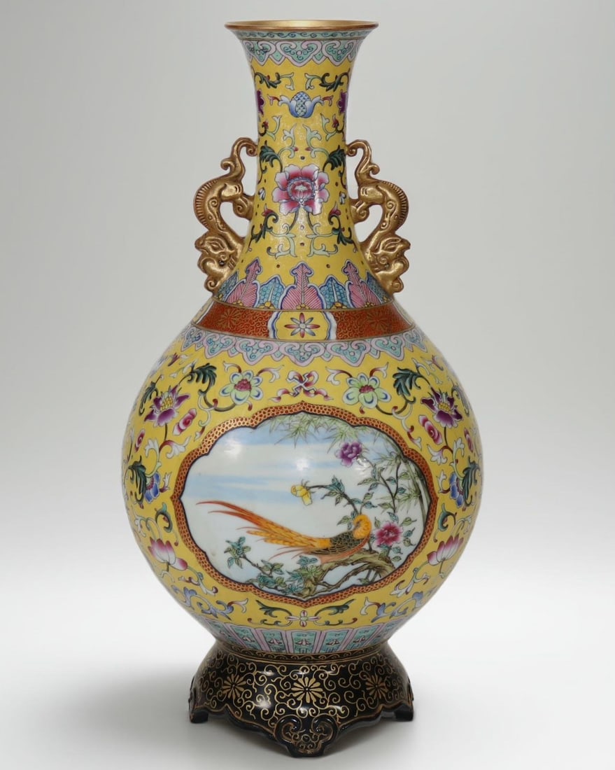 An Exquisite Enamel Flower and Bird Pattern Lotus Pattern Double-Ears Vase: An Exquisite Enamel Flower and Bird Pattern Lotus Pattern Double-Ears Vase Qing Dynasty, China Qianlong Four-character Mark Size:41.2cm (The Dimensions Of All Batches Are Manually Measured.If You Need
