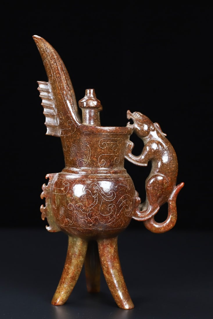 An Exquisite White Jade Phoenix Pattern Tripod Cup: An Exquisite White Jade Phoenix Pattern Tripod Cup Han Dynasty, China Size:21cmx11.2cmx6.2cm Weight:642.5g (The Dimensions Of All Batches Are Manually Measured.If You Need More Detailed