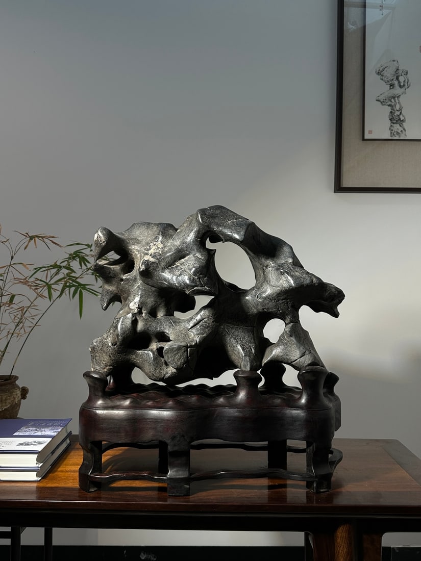 An Exquisite Taihu Stone Ornament: An Exquisite Taihu Stone Ornament Qing Dynasty, China Size:54cmx52cmx24cm (The Dimensions Of All Batches Are Manually Measured.If You Need More Detailed Information, Please Contact Our Customer