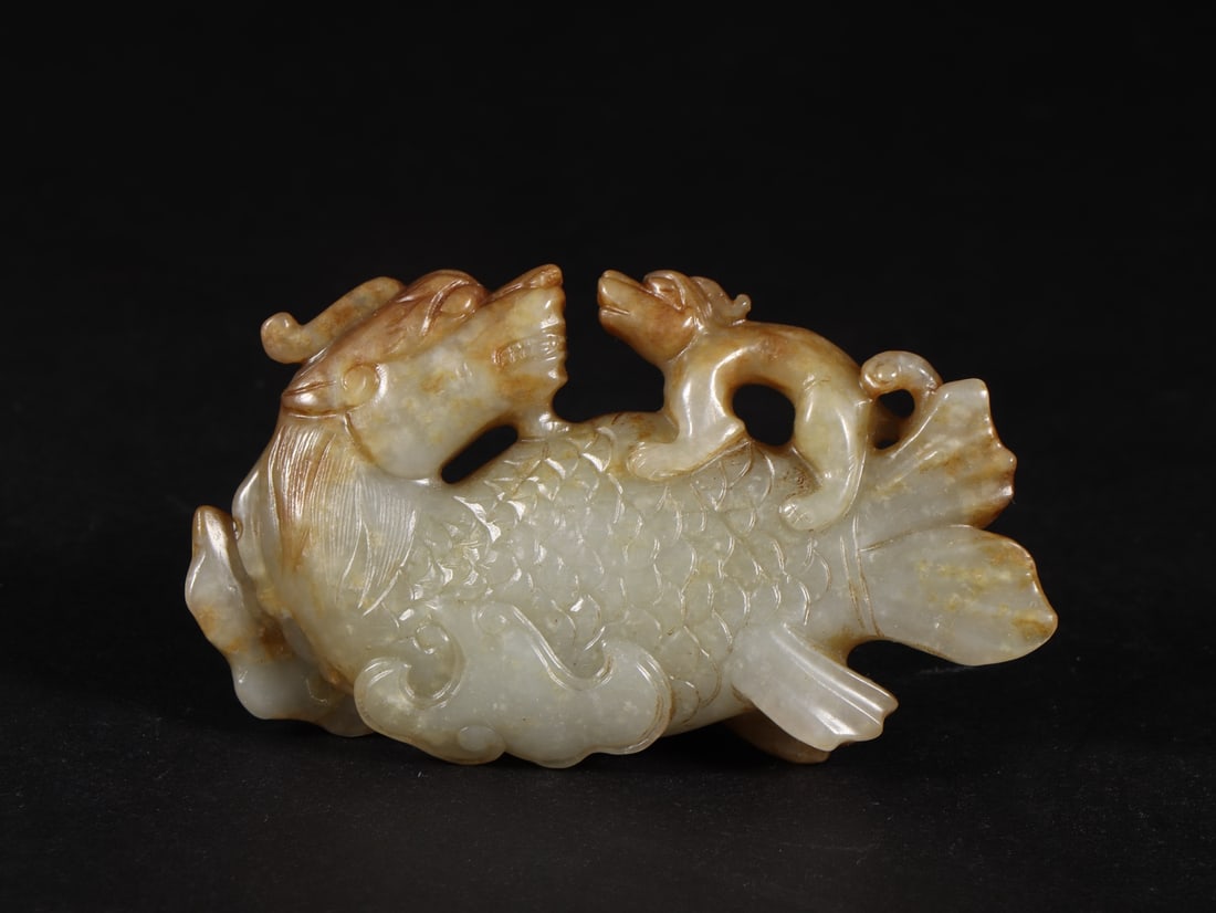 An Exquisite White Jade Auspicious Beast Ornament (1 of 9)