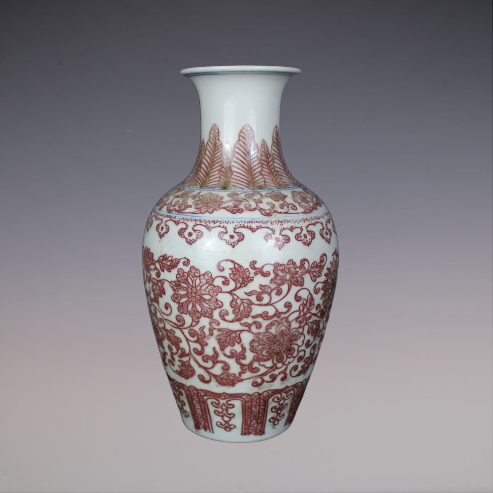 An Exquisite Underglaze-Red Lotus Pattern Vase: An Exquisite Underglaze-Red Lotus Pattern Vase Qing Dynasty, China Qianlong Six-character Mark Size:23cmx7.5cm (The Dimensions Of All Batches Are Manually Measured.If You Need More Detailed Informatio