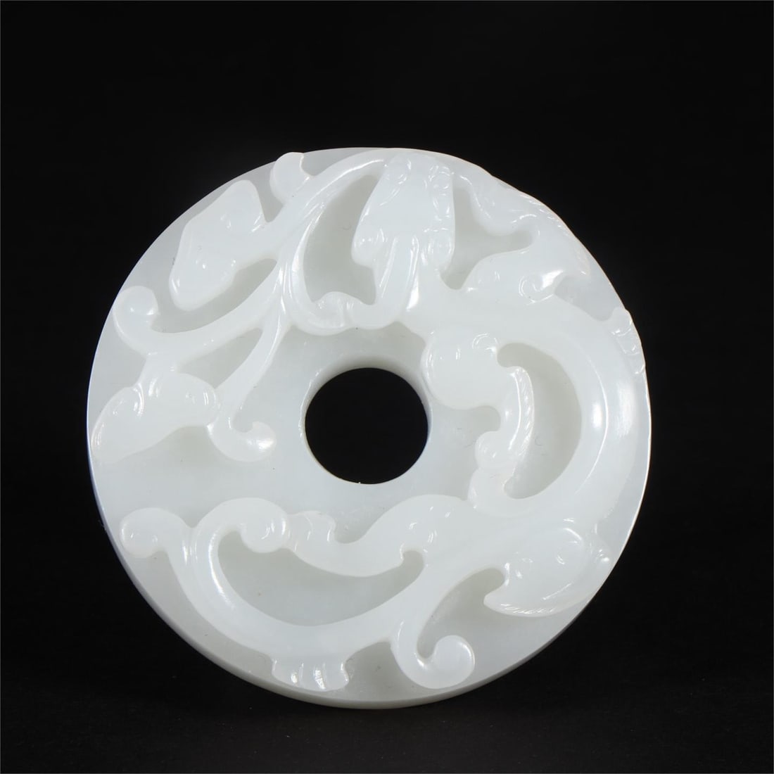A Ming Dynasty Hetian white jade carved dragon jade: Ming Dynasty Hetian white jade carved dragon bi Size:D:5.5cmT:1cmW:53g (The Dimensions Of All Batches Are Manually Measured.If You Need More Detailed Information, Please Contact Our Customer Service B