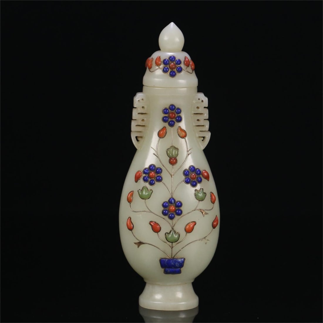 A Qing Dynasty Qianlong year made of Hendustan and Tian jade inlaid silver wire inlaid with: Qing Dynasty Qianlong year Hendusan Hetian jade inlaid silver wire inlaid multi-treasure flower pattern lid bottle Size:19.5x7x5.6cmW:0.368kg (The Dimensions Of All Batches Are Manually Measured.If Yo
