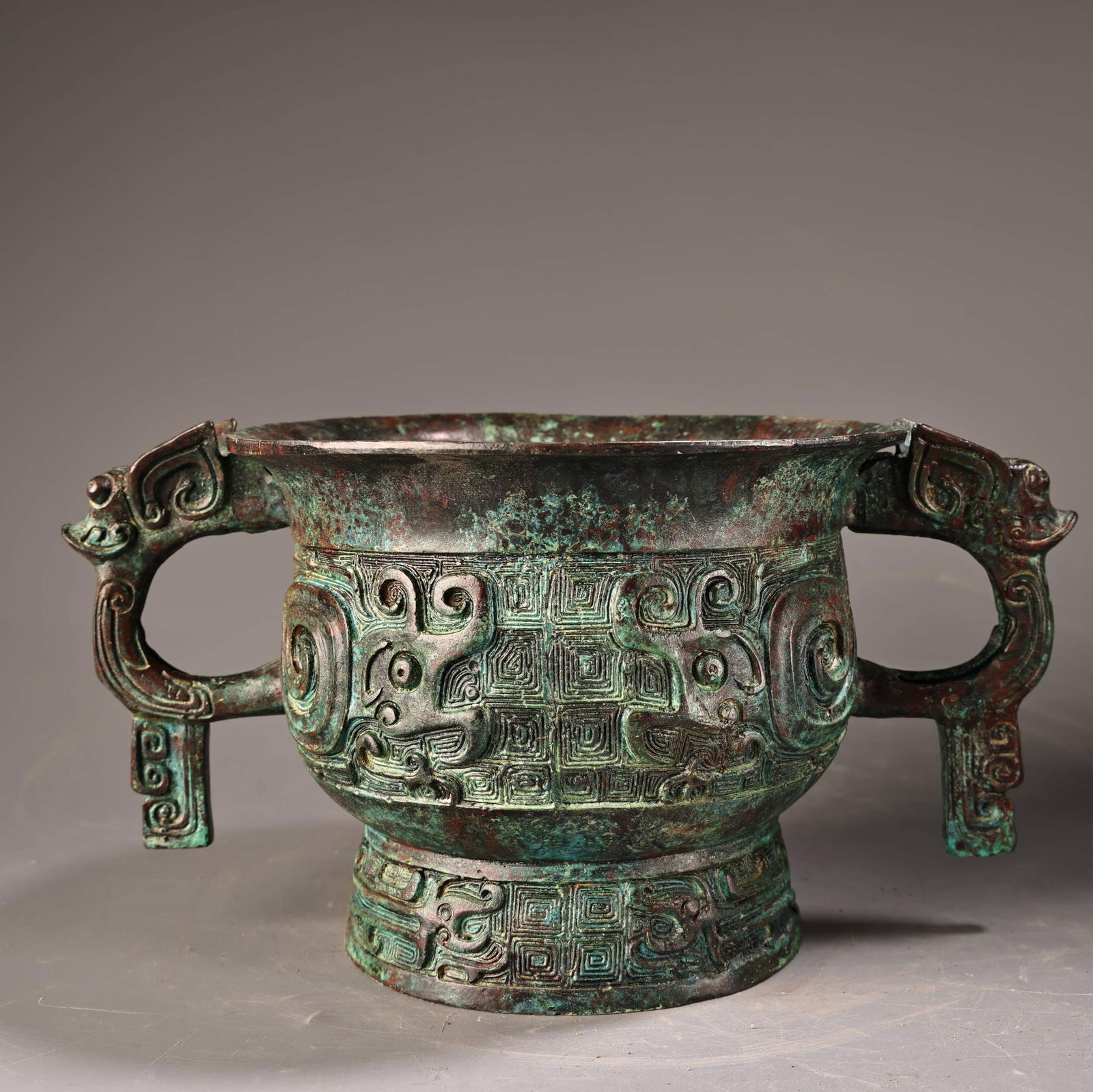 A beautifully carved inscription bronze animal ear round vessel (1 of 10)