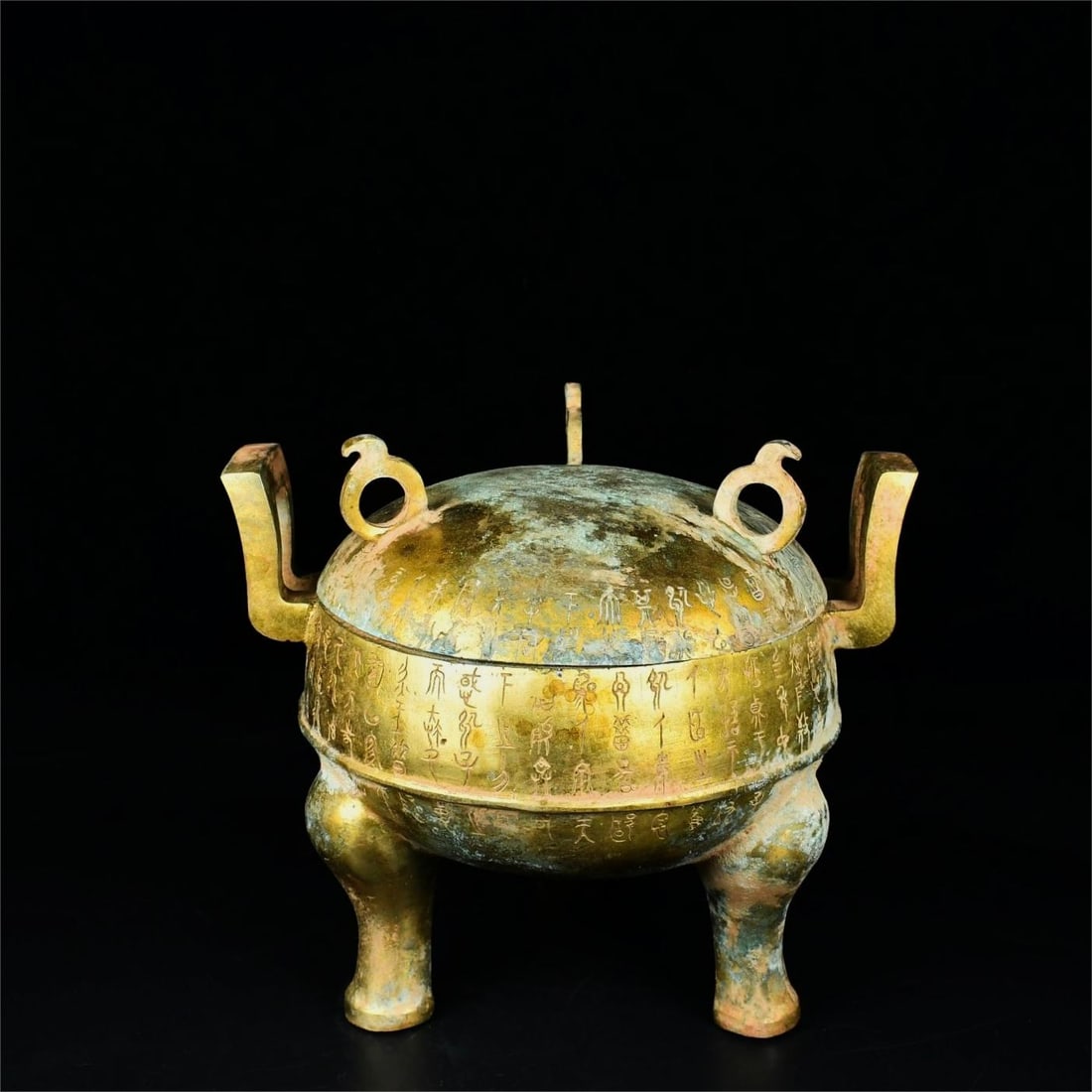 A bronze gilt inscription of the Han Dynasty covers the tripod (1 of 9)