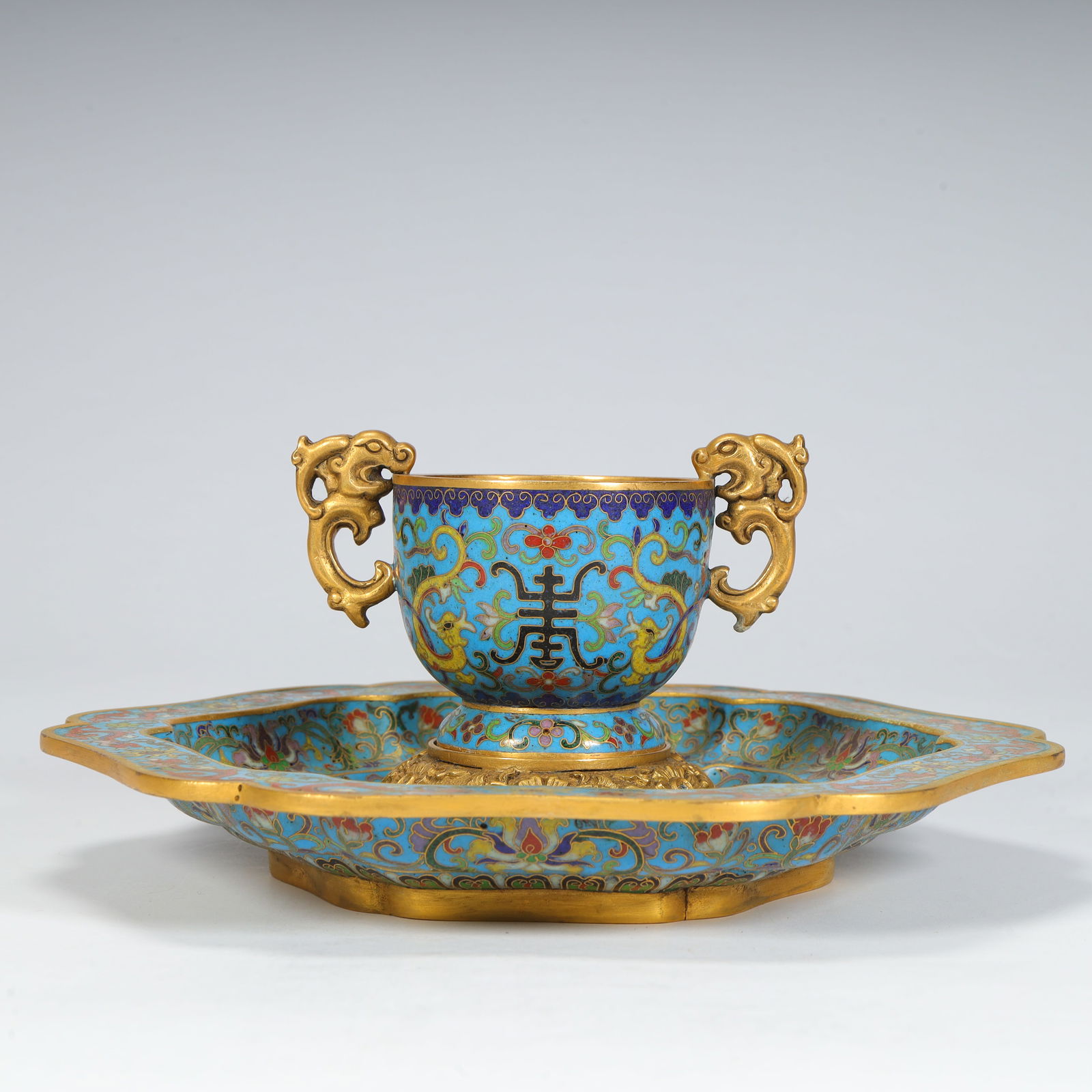 A set of Qing Dynasty Qianlong cloisonné enamel longevity borderless pattern dragon ear cup and (1 of 12)