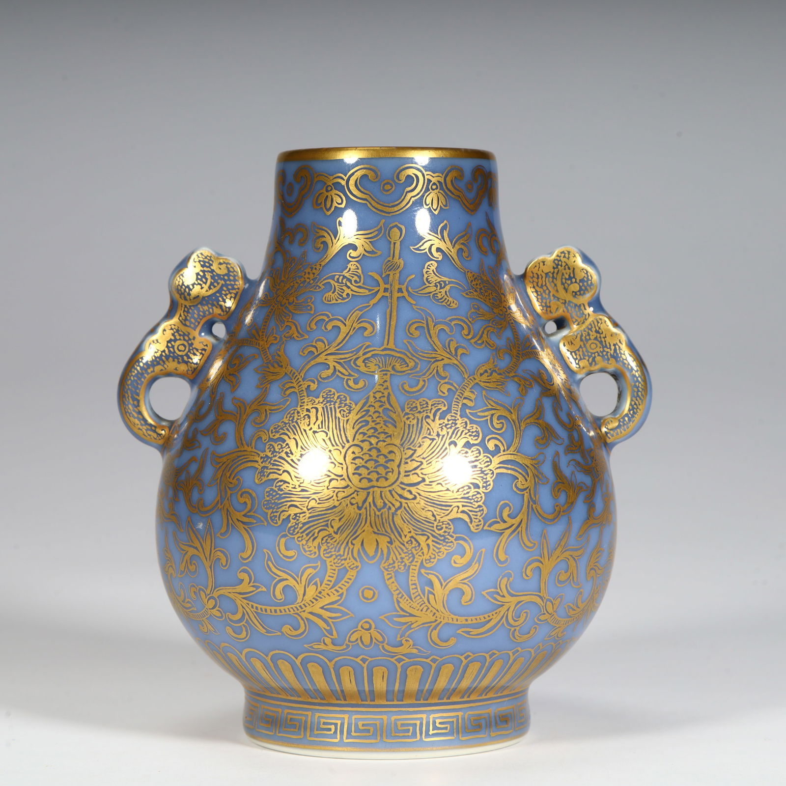 A Qing Dynasty Qianlong model sky blue glazed gold-painted entwined floral pattern amphora tube: Qing Dynasty Qianlong model sky blue glaze gilded entwined floral pattern amphora tube bottle Size:H:10.7cmL: 9.5cmW:8.5cmW:215g (The Dimensions Of All Batches Are Manually Measured.If You Need More D