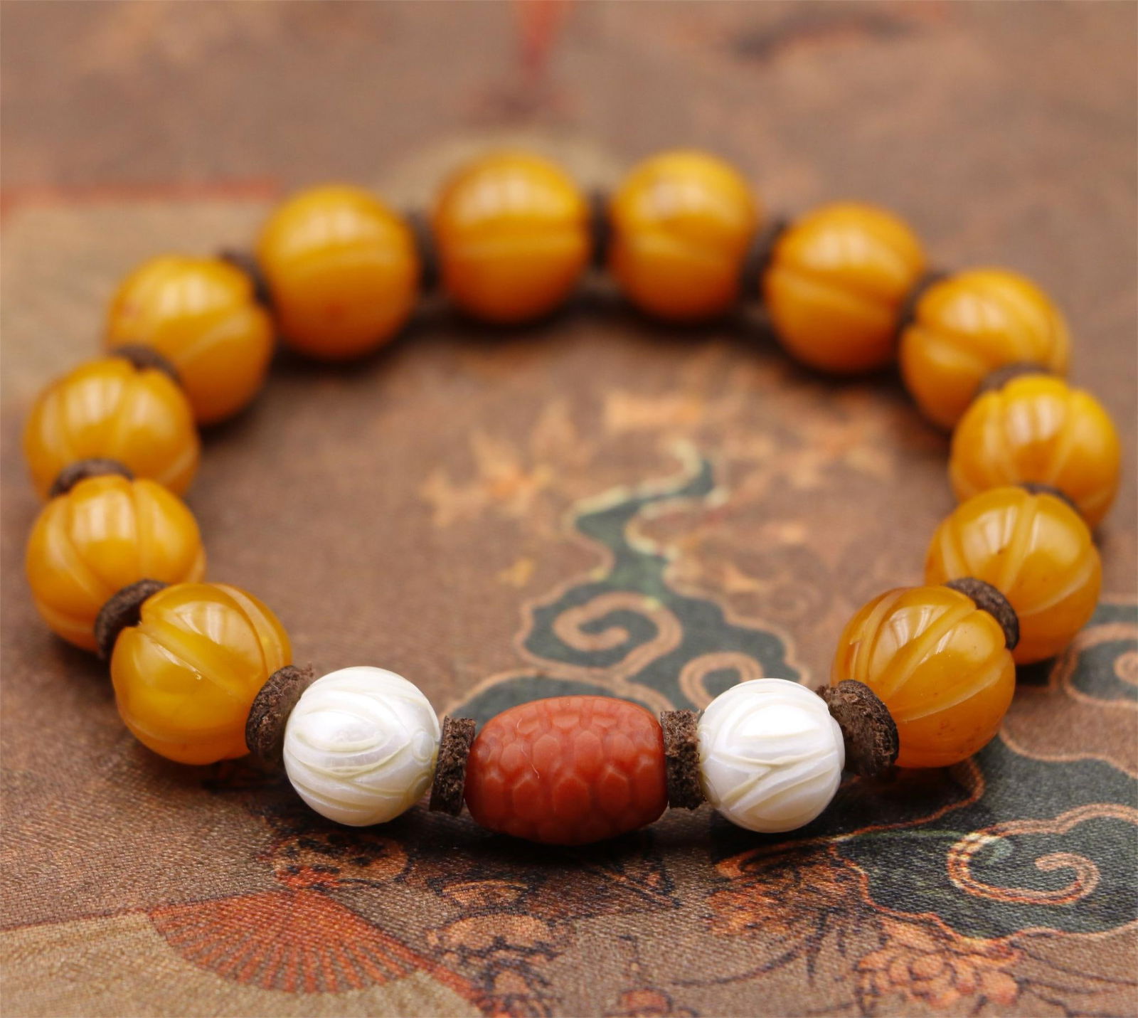 A beautiful old beeswax melon edge bead rich armor world bracelet (1 of 9)