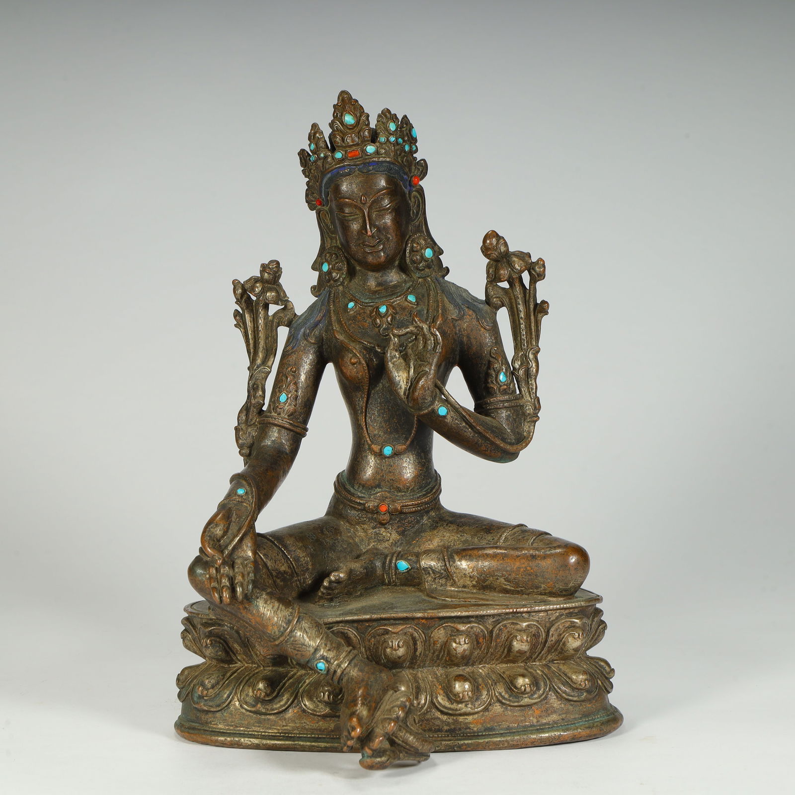 A seated statue of Tara in bronze inlaid treasure green from the Ming and Qing dynasties (1 of 13)