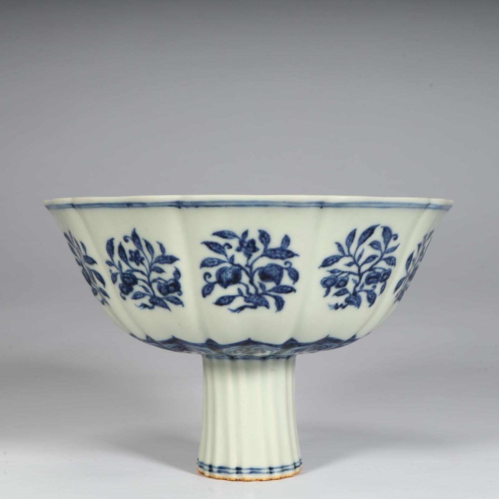 A Ming Dynasty Xuande blue and white broken branch flower fruit pattern flower mouth tall bowl (1 of 11)