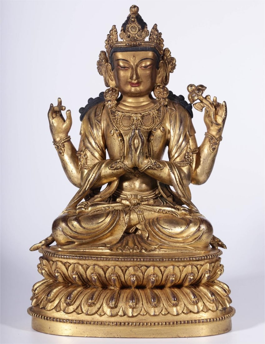 A bronze gilt four-armed seated statue of Guanyin from the Qing Dynasty (1 of 11)
