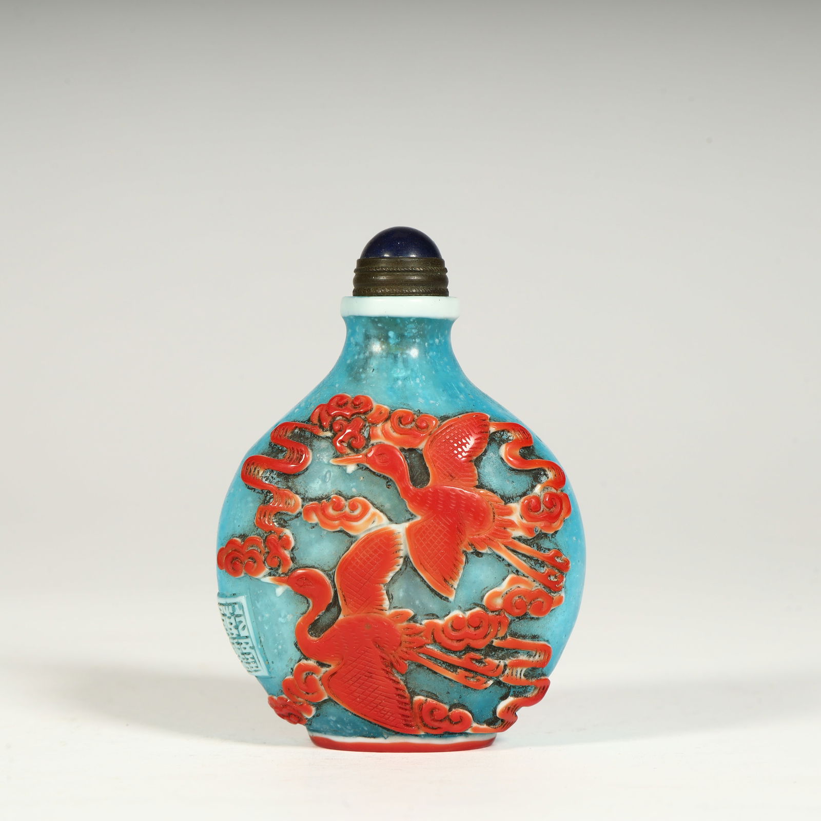 A Qing Dynasty snuff bottle with a carved cloud crane pattern (1 of 9)